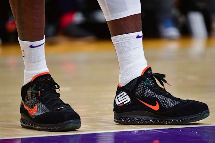 Los Angeles Lakers forward LeBron James' black and orange Nike sneakers.